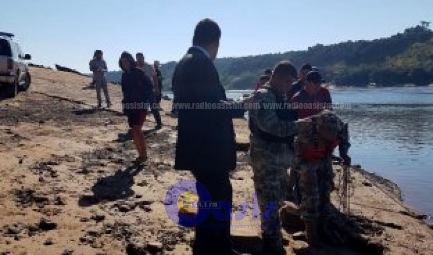 Hallan cadáver con herida de bala en el río